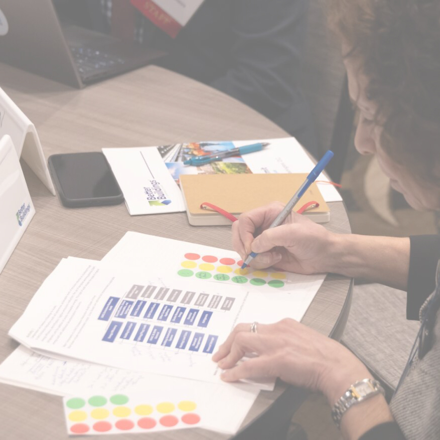 A person writing on a chart